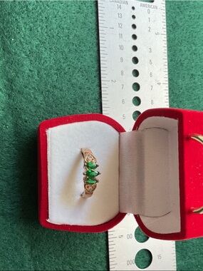 Golden Ring with Three Emerald-Green Marquise Stones